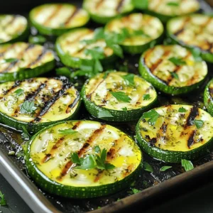 - 4 medium zucchinis, sliced into 1/2-inch thick rounds - 4 tablespoons extra virgin olive oil - 2 tablespoons freshly squeezed lemon juice - 1 teaspoon freshly grated lemon zest - 2 teaspoons dried oregano - 1 teaspoon garlic powder - 1 teaspoon sea salt - 1/2 teaspoon freshly cracked black pepper - 2 tablespoons fresh parsley, finely chopped (for garnish) You can use other oils for grilling. Avocado oil or sesame oil works well. If you have fresh herbs, use them instead of dried ones. Fresh oregano or basil adds great flavor. Adjust the amount based on your taste. When selecting zucchinis, look for ones that are firm and shiny. Avoid any that feel soft or have blemishes. Choose smaller zucchinis for a sweeter taste. Check for seasonal zucchinis in late summer. They are often at their best during this time. To make the marinade, start with a large bowl. Add the olive oil, lemon juice, and lemon zest. Next, sprinkle in the dried oregano, garlic powder, sea salt, and black pepper. Whisk everything together until mixed well. This blend of flavors makes your zucchini taste great. Marinating time is key. Let the zucchini sit in the marinade for 10 to 15 minutes. This helps the zucchini soak up the zesty flavors. Skipping this step means missing out on rich taste. First, preheat your grill to medium-high heat, about 400°F (200°C). A hot grill gives your zucchini nice grill marks and a smoky flavor. When ready, carefully place the marinated zucchini rounds on the grill. Cook them for 3 to 4 minutes on each side. Watch for tender slices with grill marks. This means they are perfectly grilled. When done, transfer the zucchini to a serving platter. Arrange them in a fan shape for a pretty look. For garnish, sprinkle fresh parsley on top. This adds a pop of color and a burst of flavor. You can also drizzle extra olive oil and sprinkle sea salt for extra taste. Enjoy your Lemon Herb Grilled Zucchini! For the complete recipe, check the [Full Recipe]. To avoid sticking on the grill, start with a clean grill. Oil the grates well before adding zucchini. This creates a non-stick surface. Use a paper towel dipped in oil to wipe the grates. For even cooking, cut zucchini into uniform pieces. I recommend 1/2-inch thick rounds. This size cooks well without burning. Grill over medium-high heat for best results. You can boost flavor with fresh herbs like basil or thyme. They add a nice twist. For a bit of heat, try red pepper flakes or sliced jalapeños. Both pair well with the lemony taste. The best grill types for zucchini are gas or charcoal grills. Both give great flavor and heat. A grill basket can help keep slices from falling through the grates. Use tongs for safe flipping. For a great grilling experience, have a spatula and a timer handy. These tools help track cooking time and make flipping easy. For the complete process, check the Full Recipe. {{image_4}} You can change the flavors of your grilled zucchini by trying different herbs and spices. Instead of oregano, use thyme or basil for a fresh twist. You can also add a pinch of red pepper flakes for a little heat. Mixing in some smoked paprika can give your dish a nice depth. Incorporating other citrus flavors makes the marinade even more fun. Try lime or orange juice instead of lemon. Both options add a unique taste that pairs well with zucchini. You can also mix lemon with lime for a zesty combo. Grilled zucchini pairs well with many other vegetables. Bell peppers, eggplant, and asparagus are great choices. You can slice them into similar sizes for even cooking. Cooking times vary, so keep an eye on your veggies. Zucchini takes about 3-4 minutes per side. Bell peppers need about 5-7 minutes, while eggplant may take up to 8 minutes. This way, you can enjoy a colorful mix on your plate. Grilled zucchini makes a tasty side dish for many meals. It pairs well with proteins like grilled chicken, fish, or steak. You can also serve it alongside grains like quinoa or couscous for a filling meal. For fun side dish ideas, try serving grilled zucchini with a yogurt sauce. A sprinkle of feta cheese or a handful of nuts can also add a nice touch. For more flavor, drizzle balsamic glaze over the top. For a complete guide to making this dish, check out the Full Recipe. To store leftover grilled zucchini, let it cool first. Place it in an airtight container. This keeps it fresh and prevents odors from mixing. You can store it in the fridge. It usually lasts for about 3 to 5 days. Reheating grilled zucchini can be tricky. The best method is to use a skillet. Heat the skillet over medium-low heat. Add a small drizzle of olive oil. Place the zucchini in the skillet. Cook it for about 2 to 3 minutes on each side. This keeps the texture nice and firm. You can also add it to pasta or salads for a tasty twist. Yes, you can freeze grilled zucchini! To do this, let it cool completely first. Then, arrange the slices in a single layer on a baking sheet. Freeze them for about 1 to 2 hours. Once frozen, transfer the slices to a freezer bag. Remove as much air as possible. Grilled zucchini can last for up to 3 months in the freezer. When ready to use, thaw it in the fridge overnight. You can also toss it directly into soups or stews. For the full recipe, check out the Lemon Herb Grilled Zucchini recipe. To cut zucchini for grilling, slice it into 1/2-inch thick rounds. This thickness helps the zucchini cook evenly and stay firm. You can also cut them into long strips if you prefer a different shape. Just ensure your slices are uniform. This way, they will grill at the same rate. For added flavor, you can cut the zucchini lengthwise and brush the cut sides with olive oil. Yes, you can prepare Lemon Herb Grilled Zucchini ahead of time. To do this, marinate the zucchini slices a few hours before grilling. You can store them in the fridge for up to 24 hours in the marinade. This will enhance the flavor. Just remember to grill them right before serving for the best taste and texture. If grilling later, store the grilled zucchini in an airtight container. Grilled zucchini is very healthy. It is low in calories and high in vitamins. Zucchini is a great source of vitamin C, which boosts your immune system. It also contains potassium, which helps with heart health. Plus, grilling keeps the zucchini's nutrients intact while adding a nice smoky flavor. Enjoy it as a side dish or in salads. You can find the full recipe in the main article. In this article, we covered the key ingredients for Lemon Herb Grilled Zucchini and preparation steps. You learned how to marinate, grill, and enhance flavors. I shared tips for choosing fresh zucchini and creative variations. Remember, fresh ingredients lead to the best taste. Enjoy experimenting with different herbs or vegetables. Grilled zucchini is not just simple but also healthy and tasty. Now, you are ready to impress at your next meal!