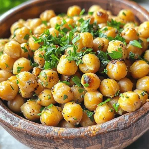 - 2 cans (15 oz each) of chickpeas, thoroughly drained and rinsed - 3 tablespoons of high-quality olive oil - 4 cloves of garlic, finely minced - 1 teaspoon of dried oregano - 1 teaspoon of dried thyme - 1 teaspoon of smoked paprika - 1/2 teaspoon of sea salt - 1/4 teaspoon of freshly ground black pepper - Fresh parsley, finely chopped (for garnish) To start, you need chickpeas. They are the star of this dish! Canned chickpeas work best for quick prep. Rinse them well to ensure they are clean. The garlic gives a lovely depth of flavor. Use fresh cloves for the best taste. Olive oil helps the seasonings stick and adds richness. Next, you have your seasonings. Dried oregano and thyme bring a nice herbal note. Smoked paprika adds a hint of smokiness, which is delightful. Salt and pepper are essential; they enhance all the flavors. Finally, fresh parsley adds color and a fresh taste. It's perfect for garnishing your dish. - Additional spices for flavor variations - Alternative oils for roasting You can mix things up with extra spices. Try chili powder for a kick. Or add cumin for warmth. If you want a different oil, avocado oil or coconut oil works well too. For the full recipe, check out the Garlic Herb Roasted Chickpeas section. Enjoy experimenting with flavors! 1. Start by preheating your oven to 400°F (200°C). This makes sure the heat is just right for roasting. 2. Grab two cans of chickpeas. Drain and rinse them well. This helps remove excess salt and makes them healthier. 3. Spread the chickpeas on a clean towel. Pat them dry gently. The drier they are, the crispier they will be! 1. In a large bowl, add the chickpeas. Pour in three tablespoons of olive oil. 2. Next, add minced garlic, oregano, thyme, smoked paprika, salt, and pepper. 3. Stir everything well. You want each chickpea to be coated in the tasty mix. This step is key to great flavor! 1. Now, spread the chickpeas evenly on a baking sheet lined with parchment paper. Don’t overcrowd them; they need space to get crispy. 2. Place the baking sheet in your oven. Roast them for 25-30 minutes. 3. Halfway through, take them out and stir. This helps them brown evenly. Keep an eye on them! You want them golden, not burnt. 4. Once they look perfect, take them out and let them cool. They will get even crispier as they cool down. 5. Finally, serve them in a bowl and garnish with chopped parsley for a fresh touch. Enjoy your healthy, tasty snack! For a complete guide, check the Full Recipe. To get crispy chickpeas, start by drying them well. After rinsing, spread them on a towel. Pat them down gently. The drier they are, the better they will roast. This step is key to avoid soggy snacks. Oven temperature is also important. Set your oven to 400°F (200°C). This high heat helps to crisp up the chickpeas. Don’t skip the stirring halfway through cooking. It ensures even browning and crispiness. Want to boost the flavor? Consider adding spices like cumin or chili powder. These spices can give your chickpeas a nice kick. You can also try curry powder for a different taste. Adjusting seasoning is easy. Taste the mixture before roasting. If you want it saltier or spicier, add more. Mix well to ensure every chickpea is coated. This way, each bite is full of flavor. For more details, check the Full Recipe. {{image_4}} To make Garlic Herb Roasted Chickpeas even more exciting, consider some fun flavor twists. - Mediterranean-inspired additions: Add lemon zest and a sprinkle of feta cheese for a bright taste. You can also toss in chopped olives or sun-dried tomatoes for a savory kick. The mix of herbs like basil or rosemary can deepen the flavor too. - Spicy enhancements for heat lovers: If you love heat, add cayenne pepper or chili powder. Toss in some crushed red pepper flakes for a fiery bite. You can also blend in a touch of hot sauce before roasting for a zesty punch. Now, let's explore how to enjoy your roasted chickpeas. - Ideas for snack pairings: Serve the chickpeas with a yogurt dip or hummus for a tasty snack. They also pair well with fresh veggies like carrots and cucumbers. Try them on a cheese board alongside crackers and fruit for a fun treat. - Ways to use roasted chickpeas in meals: Sprinkle them on salads for extra crunch and flavor. Add them to soups for texture and protein. You can also mix them into grain bowls or use them as a topping for roasted vegetables. These chickpeas add a delightful crunch and loads of flavor to any dish. For the full recipe, check out the detailed instructions above! To keep your garlic herb roasted chickpeas fresh and crispy, use an airtight container. Glass jars or resealable bags work well. Make sure to store them at room temperature. Avoid putting them in the fridge. Cold air makes them soft. For best results, store them away from light and moisture. A cool, dry place is ideal. This helps keep the crunch intact. These roasted chickpeas are best enjoyed within a week. After that, they may lose their crunch. To check if they are still good, look for signs like a stale smell or a soft texture. If they feel chewy, it's time to toss them out. For longer storage, you can freeze them. Just remember to let them thaw at room temperature before enjoying. You can find the full recipe earlier in this article. To boost the flavor, add extra spices. Consider using cayenne for heat or lemon zest for brightness. You can also mix in nutritional yeast for a cheesy taste. Fresh herbs like rosemary or basil can make a big difference too. Experimenting with flavors keeps it fun! Yes, you can use dried chickpeas. Start by soaking them overnight in water. This helps soften them. After soaking, boil them until tender. This process takes longer than canned chickpeas, but it allows for better texture and taste. Chickpeas are packed with protein and fiber. They help you stay full longer. They also support heart health due to their fiber content. Chickpeas are rich in vitamins and minerals, which are great for your body. Adding them to your diet can boost overall health. To make this recipe gluten-free, ensure your spices are certified gluten-free. For a vegan version, this recipe already fits! If you need to avoid oil, you can use vegetable broth instead of olive oil. Just be sure to monitor the roasting time for best results. For the full recipe, check out the details above! Roasting chickpeas is simple and fun. Start with chickpeas, olive oil, and your favorite spices. Follow the steps to dry, season, and roast them perfectly. Use tips to enhance flavor and ensure crispiness. Explore different variations to keep things exciting. Store properly to enjoy later. In conclusion, roasted chickpeas are a tasty, healthy snack. Experiment with flavors and share them with friends. With this guide, you can enjoy the perfect crunchy treat any time.