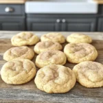 To make classic Snickerdoodle cookies, you need a few simple ingredients that come together to create a delightful treat. Here’s what you’ll need: - 1 cup unsalted butter, softened - 1 ½ cups granulated sugar - 2 large eggs - 1 teaspoon pure vanilla extract - 2 ¾ cups all-purpose flour - 2 teaspoons cream of tartar - 1 teaspoon baking soda - ½ teaspoon salt - 3 tablespoons granulated sugar (for the cinnamon-sugar coating) - 1 tablespoon ground cinnamon (for the cinnamon-sugar coating) When it comes to ingredient substitutions, here are some tips: - If you don’t have cream of tartar, you can use lemon juice or white vinegar instead. Use 1 teaspoon of either for this recipe. - You can swap the all-purpose flour with a gluten-free blend if needed. - For a dairy-free option, replace the butter with a vegan butter substitute. These ingredients create a soft, chewy cookie with a sweet cinnamon flavor. They are easy to find and perfect for baking days. You can find the Full Recipe in the full article for step-by-step instructions on making these delicious cookies! 1. Preheat your oven to 350°F (175°C). Line two baking sheets with parchment paper. This helps the cookies not stick. 2. In a large bowl, cream 1 cup of softened butter. Use an electric mixer on medium speed for 2 to 3 minutes. The butter should look light and fluffy. 3. Gradually add 1 ½ cups of granulated sugar. Keep mixing until it’s well combined. 4. Add 2 large eggs, one at a time. Mix well after each egg. Add 1 teaspoon of vanilla extract and stir until mixed. 1. In another bowl, whisk together 2 ¾ cups of all-purpose flour, 2 teaspoons of cream of tartar, 1 teaspoon of baking soda, and ½ teaspoon of salt. This helps the cookies rise evenly. 2. Slowly add the dry mix to the wet mixture. Use a spatula or wooden spoon. Mix until the dough just comes together. Don’t overmix; this keeps cookies tender. 1. In a small bowl, mix 3 tablespoons of sugar with 1 tablespoon of ground cinnamon for the coating. 2. Scoop the dough into balls, about 1 inch wide. Roll each ball in the cinnamon-sugar mix until fully coated. 3. Place the dough balls on the baking sheets. Leave about 2 inches between them to allow spreading. 4. Bake for 10-12 minutes. The edges should set and the tops should crack slightly. The centers may look soft but will firm up as they cool. 5. Let the cookies cool on the baking sheets for 5 minutes. Then, move them to a wire rack to cool completely before you enjoy them. To get the best texture for snickerdoodle cookies, use room temperature ingredients. This helps the butter mix well with sugar. When you cream them, they become light and fluffy. Avoid overmixing the dough. Mix just until you see no dry flour. Overmixing can make your cookies tough. To enhance flavor, add a bit more vanilla. You can also try other spices like nutmeg or ginger. These spices will give your cookies a unique twist. Don’t be afraid to experiment! You can add mix-ins too. Chocolate chips or butterscotch chips make a fun addition. Just fold them in gently at the end. When serving, arrange your cookies on a nice plate. A decorative platter makes them look special. Dust a little cinnamon on top for flair. You can also serve them with a glass of milk. It’s a classic pairing that everyone loves. For a fun twist, try stacking them high for a cookie tower! {{image_4}} You can easily add a twist to your classic snickerdoodles. Try mixing in chopped nuts like pecans or walnuts. The nuts add a nice crunch and enhance the flavor. Just about ½ cup will do. Fold them into the dough right after you mix in the flour. This small change makes your cookies even more special. If you love chocolate, you can incorporate it into snickerdoodles. Add chocolate chips or cocoa powder to the dough. About ½ cup of chocolate chips works great. For a richer taste, use ¼ cup of cocoa powder. Just mix these in when you combine the dry ingredients. The chocolate adds a delightful surprise with each bite. For those with dietary needs, snickerdoodles can be made gluten-free. Substitute regular flour with gluten-free all-purpose flour. You can also use sugar substitutes, like coconut sugar or monk fruit sweetener. These options keep the cookies tasty while meeting your dietary goals. Just follow the same measurements as the original recipe. To keep your snickerdoodle cookies fresh, use an airtight container. A glass jar or plastic bin works well. This helps keep moisture out and flavor in. Your cookies will stay soft and tasty when stored this way. They last about one week at room temperature. If you want to enjoy them longer, try freezing. Freezing snickerdoodle cookies is simple. First, let them cool completely after baking. Then, place them in a single layer on a baking sheet. Put the sheet in the freezer for a few hours. This will freeze the cookies individually. Once frozen, transfer them to a freezer-safe bag. Remove as much air as possible. They can last up to three months in the freezer. When you want to eat a cookie, take it out. Let it thaw at room temperature for about 30 minutes. You can also warm it in the oven for a few minutes. Enjoy your fresh-tasting cookie! If you want the full recipe, check out the detailed guide. Snickerdoodle cookies stand out because of cream of tartar. This ingredient gives the cookies their soft texture and slight tang. Cream of tartar also helps the cookies rise well. It reacts with baking soda, making the cookies fluffy. This is what makes Snickerdoodles different from other cookies. Yes, you can make Snickerdoodles ahead of time. You can prepare the dough and chill it in the fridge. Chilling the dough helps the cookies hold their shape. This is a great trick if you want fresh cookies later. Baked cookies can also be made in advance. Just store them in an airtight container. You can tell when Snickerdoodles are done by looking at them. The edges should look set, and the tops might crack a little. The centers can look soft, but they will firm up as they cool. If the cookies are golden brown and fragrant, they are likely done. Snickerdoodle cookies do not need to be refrigerated. Store them in a cool, dry place. Use an airtight container to keep them fresh. If you live in a humid area, refrigeration might help. Just let them sit out to come back to room temperature before eating. For the complete recipe, check out the Full Recipe link on the blog. You now know how to make delicious Snickerdoodle cookies. We covered the key ingredients and steps, like creaming the butter and sugar. You learned tips to achieve the perfect texture and flavor. Plus, we explored fun variations like nutty and chocolate options. Storing and freezing your cookies is simple too. Enjoy baking these treats, and share them with friends. With practice, you’ll make the best Snickerdoodles ever.