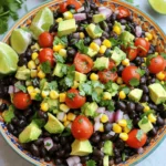 The Fiesta Black Bean Corn Salad shines with fresh and vibrant ingredients. You can make it in just 15 minutes. Here’s what you need: - 1 can (15 oz) black beans, thoroughly rinsed and drained - 1 cup corn kernels (fresh, frozen, or canned) - 1 medium red bell pepper, diced - 1 small red onion, finely chopped - 1 cup cherry tomatoes, halved - 1 ripe avocado, diced - 1/4 cup fresh cilantro, chopped - 2 tablespoons freshly squeezed lime juice - 1 tablespoon olive oil - 1 teaspoon ground cumin - Salt and pepper to taste These ingredients offer a mix of textures and flavors. The black beans provide protein, while corn adds sweetness. The red bell pepper and red onion add crunch and color. Juicy cherry tomatoes give freshness. The avocado adds creaminess, and cilantro brings a delightful herbal note. Lime juice and olive oil create a zesty dressing, while cumin adds warmth. Make sure to use fresh ingredients for the best taste. This salad is perfect for gatherings and pairs well with grilled meats or as a standalone dish. You can find the complete preparation steps in the Full Recipe. - Combine black beans, corn, diced red bell pepper, red onion, and cherry tomatoes in a bowl. - Toss ingredients gently for even distribution. Start by grabbing a large mixing bowl. You want to make sure it has enough space for all your ingredients. First, add the black beans. Rinse them well before using to remove excess salt. Next, throw in the corn. You can use fresh, frozen, or canned corn based on what you have. Then, chop your red bell pepper into small, bite-sized pieces and add it. Dice the red onion finely. This will add a nice bite to your salad. Finally, cut the cherry tomatoes in half to show off their juicy insides. Once all the ingredients are in the bowl, toss everything gently with your hands or a spoon. This helps mix the flavors without smashing anything. - Fold in diced avocado and chopped cilantro carefully. - Ensure avocado pieces remain intact for texture. Now it’s time for the avocado and cilantro. Cut the avocado into small cubes. Add it to the salad. Be gentle when folding it in. You want the pieces to stay whole for a nice texture. Next, chop the cilantro coarsely. Toss it in and fold everything together slowly. The cilantro will add a fresh taste that brightens up the whole dish. - Whisk lime juice, olive oil, cumin, salt, and pepper in a small bowl. - Emulsify the dressing for enhanced flavor. For the dressing, grab a small bowl. Add the freshly squeezed lime juice. This gives the salad a zesty kick. Next, pour in the olive oil. It adds richness to the dressing. Then, add ground cumin, salt, and pepper. Whisk them together until the mixture looks smooth. This step is important. It helps the flavors blend well. - Drizzle dressing over the salad mixture and stir gently. - Allow the salad to rest for 10-15 minutes before serving for flavor melding. Finally, drizzle your dressing over the salad mixture. Stir gently to coat everything. You want each bite to be full of flavor. After mixing, let the salad sit for about 10-15 minutes. This resting time allows the flavors to meld beautifully. When ready, serve it in a vibrant bowl for a festive look. For a final touch, garnish with extra cilantro and lime wedges. Enjoy this delightful dish! For the full recipe, check out the provided link. Choose the freshest ingredients for the best flavor. Look for shiny, firm black beans. If you use canned beans, rinse them well. For corn, fresh is great, but frozen or canned works too. When picking avocados, find ones that yield slightly when pressed. This means they are ripe but not mushy. For tomatoes, select ones with rich color and a slight give. These will be juicy and sweet, perfect for your salad. For an attractive presentation, use a large, colorful bowl. This makes the salad pop. When serving, add a sprinkle of fresh cilantro on top. Place lime wedges on the side for guests to use. This adds a fun touch and invites interaction. To boost the taste, try adding spices like chili powder or paprika. Fresh herbs like parsley or green onions can also brighten the dish. If you want a different dressing, swap lime juice for lemon juice. You could even add a splash of vinegar for a tangy kick. These tips will help you create a vibrant and tasty Fiesta Black Bean Corn Salad that everyone will love. For the complete recipe, check out the Full Recipe section. {{image_4}} You can switch black beans for kidney or pinto beans. I love using kidney beans. They add a nice texture and color. Pinto beans work well too. They have a creamy taste that blends smoothly with other ingredients. This simple swap keeps the salad fresh and interesting. If you want a protein boost, try adding grilled chicken, shrimp, or tofu. Grilled chicken gives a smoky flavor. Shrimp adds a sweet touch. Tofu is perfect for a plant-based option. Just dice or slice these proteins and mix them in. You will have a filling meal that satisfies your hunger. Incorporate seasonal veggies for added freshness and crunch. Think bell peppers, zucchini, or radishes. They not only enhance flavor but also bring beautiful colors. Adding seasonal ingredients makes your salad lively and tasty. You can even consider using fruits like mango or peach for a sweet twist. This keeps the dish vibrant and exciting. Enjoy these variations to make your Fiesta Black Bean Corn Salad even more delightful! For the full recipe, check out the recipe section above. To keep your Fiesta Black Bean Corn Salad fresh, store leftovers in an airtight container. This prevents air from making the ingredients soggy. It is best to use glass or plastic containers with tight lids. This way, your salad stays flavorful and crisp. In the fridge, this salad lasts about 3 to 5 days. To enjoy the best taste and texture, eat it within the first 3 days. After that, the ingredients may start to break down. Always check for any off smells or changes in color before eating. You can freeze this salad, but it's not the best option. The texture of the beans and avocado can change when frozen. If you have a lot left, consider freezing the beans and corn separately. This way, you can use them later in other dishes. When defrosting, enjoy them in soups or casseroles for a tasty meal. Yes, you can make this salad ahead of time. I suggest making it a few hours before serving. This allows the flavors to blend. Store the salad in the fridge to keep it fresh. Just remember to add the avocado right before serving. This way, it stays bright and green. If you're out of lime juice, don't worry! You can use lemon juice instead. It gives a similar tangy flavor. Another option is vinegar, like apple cider or red wine vinegar. Both will add a nice punch to the dressing. Yes, this salad is vegan! All the ingredients are plant-based. You can enjoy it without any animal products. It’s perfect for everyone, especially those who follow a vegan diet. To adjust the spice level, start by adding less cumin. You can also skip adding hot sauce if you like it mild. If you prefer more heat, try adding diced jalapeños or chili powder. Taste as you go to find the perfect balance for you. This blog post covered how to create a fresh and tasty Fiesta Black Bean Corn Salad. We discussed the ingredients, from black beans to ripe avocados, and shared step-by-step instructions for preparation. You learned tips for selecting fresh produce and suggestions for tasty variations. Remember, this salad is easy to make and perfect for sharing. Whether you enjoy it as is or customize it with added proteins, it will be a hit. Fresh ingredients make every bite satisfying. Enjoy your salad and impress your friends!