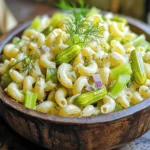 - 2 cups elbow macaroni - 1 cup dill pickles, finely chopped - 1/2 cup red onion, finely diced - 1/2 cup celery, finely diced - 1/2 cup mayonnaise - 1/2 cup sour cream - 2 tablespoons pickle juice (from the jar) - 1 tablespoon Dijon mustard - 1 teaspoon garlic powder - 1 teaspoon onion powder - Salt and freshly ground black pepper, to taste - Fresh dill sprigs, for garnish To start, you need two cups of elbow macaroni. This is the base of your pasta salad. Boil it until it is al dente and then cool it with cold water. Next, gather one cup of finely chopped dill pickles. This gives a great crunch and tang. You’ll also need half a cup each of red onion and celery, both diced finely. For the creamy dressing, you will use half a cup of mayonnaise and half a cup of sour cream. Two tablespoons of pickle juice add that perfect zing. One tablespoon of Dijon mustard brings in depth of flavor. Finally, add garlic powder and onion powder for extra taste. Don’t forget salt and pepper to season to your liking. Fresh dill sprigs will make a lovely garnish. If you want to change things up, there are some easy swaps. You can use any small pasta shape instead of elbow macaroni. If you prefer, Greek yogurt can replace sour cream for a lighter option. You can also switch out the mayonnaise for an avocado spread. If you want more crunch, try adding bell peppers or carrots. For a kick, add chopped jalapeños. Use dill relish if you cannot find dill pickles. These substitutions keep the spirit of the dish while letting your taste shine through. Start by boiling a large pot of salted water. Once it bubbles, add 2 cups of elbow macaroni. Cook the pasta for 7 to 10 minutes until it is tender but still firm. Drain the pasta in a colander and rinse it under cold water. This stops the cooking process and cools the macaroni. Set it aside to drain well. Grab a large mixing bowl. In it, combine 1/2 cup of mayonnaise, 1/2 cup of sour cream, 2 tablespoons of pickle juice, and 1 tablespoon of Dijon mustard. Add 1 teaspoon of garlic powder and 1 teaspoon of onion powder. Season with salt and black pepper. Whisk these together until you have a smooth, creamy dressing. Now, it’s time to mix! Add the cooled elbow macaroni to your creamy dressing. Gently toss the macaroni until every piece is coated. Next, fold in 1 cup of finely chopped dill pickles, 1/2 cup of diced red onion, and 1/2 cup of diced celery. Ensure everything is mixed well without breaking the pasta. Taste the salad and adjust the seasoning if needed. Cover and chill it for at least 30 minutes. This helps the flavors blend. When ready to serve, garnish with fresh dill sprigs for a nice touch. For the full recipe, check out the details in the earlier sections. Cook pasta in a big pot of salted water. The salt helps flavor the pasta. Use a timer to avoid overcooking. I suggest cooking it until it is al dente. This means it should be firm when you bite into it. After cooking, drain the pasta and rinse it with cold water. This stops the cooking and cools the pasta down. Taste your pasta salad before serving. You can add more salt, pepper, or pickle juice if needed. If it tastes dull, a bit more pickle juice can add zing. Always mix well after adding any seasoning. This helps ensure every bite is flavorful. Make your creamy dill pickle pasta salad a few hours in advance. This allows the flavors to blend well. Cover it tightly and chill it in the fridge. It tastes best when it sits for at least 30 minutes. For maximum flavor, try to let it chill overnight. This will make your dish even more delicious. For the full recipe, check out the Creamy Dill Pickle Pasta Salad 🥒 section above. {{image_4}} You can change the pasta shape for fun! The classic elbow macaroni works great. But you can try shells, rotini, or even penne. Each shape holds the creamy dressing well. Using different shapes can make the dish look unique too. Plus, it can add a fun twist to each bite! Want to make it hearty? Try adding proteins. Cooked chicken or diced ham pairs nicely with the salad. You can also try tuna or chickpeas for a different taste. For veggies, add bell peppers, peas, or corn. These choices boost flavor and nutrition. Don’t be afraid to mix and match based on what you love! Feel free to switch up the dressing. If you want a lighter option, use Greek yogurt instead of sour cream. You can also try a vinaigrette for a tangy twist. For extra flavor, add a dash of hot sauce or some fresh herbs. These swaps can make the recipe your own. Check the Full Recipe for more ideas! Store your creamy dill pickle pasta salad in an airtight container. This keeps it fresh. Place it in the fridge right after serving. The salad tastes even better after chilling. I do not recommend freezing this pasta salad. The texture changes when thawed. The creamy dressing may separate and become watery. It's best enjoyed fresh or refrigerated. In the fridge, this salad lasts about three to four days. Always check for signs of spoilage before serving. If it looks or smells off, toss it out. Enjoy it while it's fresh for the best taste! Yes, you can use gluten-free pasta. Many brands offer great options. I suggest using a gluten-free elbow macaroni. It cooks well and holds the dressing nicely. Just follow the cooking instructions on the package. This way, everyone can enjoy the creamy dill pickle pasta salad. You can make it healthier by adding fresh veggies. Try adding chopped bell peppers, cucumbers, or carrots. You can also use Greek yogurt instead of sour cream. This swap adds protein and reduces fat. Lastly, use less mayonnaise or a light version for fewer calories. Creamy dill pickle pasta salad pairs well with grilled chicken or fish. You can also add it to a picnic plate with sandwiches. It complements burgers or hot dogs nicely. For a light meal, serve it alongside a fresh garden salad. Enjoy the mix of flavors! This blog covered how to make creamy dill pickle pasta salad. We discussed the key ingredients, preparations, and substitutions. You learned step-by-step instructions for cooking and combining the pasta and dressing. We shared helpful tips for perfect seasoning and storage. You also found variations to try different pasta shapes or proteins. With this knowledge, you can create a tasty pasta salad that suits your taste. Enjoy experimenting and making it your own!