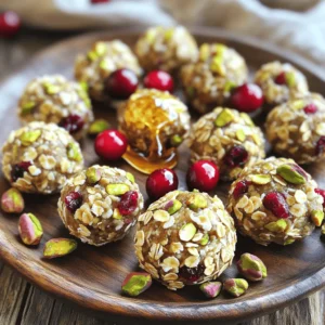 To make these tasty Pistachio Cranberry Energy Bites, gather the following items: - 1 cup rolled oats - 1/2 cup unsalted pistachios, roughly chopped - 1/2 cup dried cranberries, roughly chopped - 1/2 cup natural almond butter (or any nut butter of your choice) - 1/4 cup honey or maple syrup - 1 tablespoon chia seeds - 1 teaspoon pure vanilla extract - A pinch of salt When measuring your ingredients, use standard measuring cups for accuracy. Chop the pistachios and cranberries into small pieces. This helps them mix well. For the nut butter, let it sit at room temperature. This will make it easier to mix. If you use honey, warm it slightly so it blends smoothly with other wet ingredients. You can switch out some ingredients based on your taste or dietary needs. - Use any nut or seed butter if you prefer. - Swap honey for agave syrup for a vegan option. - If you need a nut-free version, use sunflower seed butter. - You can replace cranberries with raisins or chopped dates. These swaps keep the energy bites tasty and healthy! Start with a large mixing bowl. Add 1 cup of rolled oats, 1/2 cup of roughly chopped pistachios, 1/2 cup of chopped dried cranberries, and 1 tablespoon of chia seeds. Mix these dry ingredients well. Make sure everything is evenly spread out. This step is key for great flavor in every bite. In a separate bowl, combine 1/2 cup of natural almond butter, 1/4 cup of honey or maple syrup, and 1 teaspoon of pure vanilla extract. Add a pinch of salt for taste. Whisk these wet ingredients together until smooth. This mixture should be creamy and well blended. Pour the wet mixture into the bowl with the dry ingredients. Stir everything together vigorously. You want to ensure all the dry ingredients are covered in the wet mix. Keep stirring until a sticky mixture forms. This is the base for your energy bites. Now you are ready to shape your energy bites! For the best texture, balance is key. Use rolled oats for a chewy base. The chopped pistachios add crunch, while cranberries give a burst of sweetness. If the mixture feels too dry, add a splash of water or more nut butter. If it's too wet, sprinkle in extra oats. This way, you get a perfect bite every time. When rolling, make sure your hands are clean and slightly damp. This helps prevent the mixture from sticking. Take small portions, about one inch each, and roll them gently. If you want a little extra fun, roll the bites in shredded coconut or crushed nuts. This adds flavor and a nice look. These energy bites are great for any time. Serve them as a snack or with breakfast. You can place them on a colorful plate or in a mason jar. For a special touch, add a few whole pistachios and cranberries around the bites. They make a beautiful display and taste amazing too! {{image_4}} You can easily change the flavor of your energy bites. For a chocolate twist, add mini chocolate chips. They blend well with the pistachios and cranberries. If you enjoy a spicy touch, mix in a dash of cinnamon or nutmeg. This adds warmth to each bite. Coconut flakes also make a great addition. They bring a tropical flair and a chewy texture. To make these bites vegan, swap honey for maple syrup. Both sweeteners work well, but maple syrup keeps it plant-based. If you need a gluten-free option, use certified gluten-free oats. This keeps the recipe safe for those with gluten sensitivities. Remember to check other ingredients for hidden gluten sources. You can swap ingredients based on what you have. Instead of almond butter, use peanut or sunflower seed butter. This keeps the bites creamy and rich. For cranberries, any dried fruit works! Try raisins, apricots, or even dates for a different taste. You can also mix nuts. If you don’t have pistachios, use walnuts or almonds. Each swap brings a new flavor and texture. To keep your pistachio cranberry energy bites fresh, store them in an airtight container. This helps keep moisture out and flavor in. Place a piece of parchment paper between layers if you stack them. This prevents them from sticking together. Always store the bites in the fridge. They taste best when chilled! You can freeze energy bites for longer storage. First, place them on a baking sheet. Make sure they are not touching each other. Freeze them for about an hour. Once frozen, transfer them to a freezer-safe bag. Remove as much air as you can. They can last up to three months in the freezer. Just thaw them in the fridge before enjoying! These energy bites are great for a week in the fridge. After that, they may lose flavor. Always check for any signs of spoilage before eating. If they smell off or look strange, throw them away. When stored properly, they stay tasty and nutritious. Enjoy your snacks while they are fresh! You can easily change the flavors in your energy bites. Try adding different fruits like raisins or apricots. You can also switch the nut butter. Almond butter is great, but peanut or cashew butter works well too. Mix in some spices like cinnamon or cocoa powder for a twist. If you like crunch, add more nuts or seeds. Adjust the sweetness by using less honey or maple syrup. These simple tweaks let you make the bites fit your taste. Yes, you can use any nuts or seeds you like. Almonds, walnuts, or pecans all add unique flavors. If you want a nut-free option, try sunflower seeds or pumpkin seeds. Each nut or seed brings its own taste and texture. Just remember to chop larger nuts so they mix well. The key is to keep the same total amount of nuts or seeds for the best texture. You can find pre-made energy bites at health food stores or online. Many brands offer various flavors and ingredients. Look for options that use natural sweeteners and whole foods. Reading the label helps you choose bites that fit your diet. If you want a quick snack without making them, buying pre-made is a good choice. Just keep in mind that homemade bites taste fresh and you control the ingredients! In this blog post, we explored making Pistachio Cranberry Energy Bites. We reviewed the needed ingredients, proper measurement, and preparation tips. You learned step-by-step instructions to mix and combine all parts. I shared tips on perfecting texture and rolling the bites. We discussed variations for flavors and dietary needs, plus storage methods for longevity. Remember, these bites are customizable and easy to make. I hope you feel ready to create your tasty snacks!