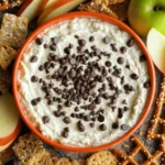 - 1 cup cottage cheese - 1/2 cup creamy Greek yogurt - 1/3 cup honey or maple syrup - 1 teaspoon pure vanilla extract Cottage cheese is the star of this dip. It brings a creamy texture and a boost of protein. You can choose full-fat or low-fat based on your taste. The creamy Greek yogurt adds richness and tang. Sweeteners like honey or maple syrup give the dip a nice sweetness. You can adjust it to your liking. - 1/4 cup mini chocolate chips - 1/4 cup crushed graham crackers - A pinch of sea salt Mini chocolate chips add a touch of indulgence. They melt slightly in the dip, creating bursts of chocolate in every bite. Crushed graham crackers add a delightful crunch. Sea salt balances the sweetness and enhances all the flavors. - Sliced apples - Crunchy pretzels - Assorted cookies For dipping, sliced apples add freshness and a bit of tartness. Crunchy pretzels bring a salty, satisfying crunch. Assorted cookies offer a fun and sweet way to enjoy the dip. You can mix and match your favorites for a fun snack experience. First, grab a medium-sized mixing bowl. Add one cup of cottage cheese and half a cup of creamy Greek yogurt. Blend these two together using a hand mixer or a sturdy whisk. Mix until the dip is smooth and creamy. Make sure there are no lumps left. A smooth base is key to a great dip. Next, it’s time to sweeten things up. Add one-third cup of honey or maple syrup into the creamy mixture. Then, toss in one teaspoon of pure vanilla extract. Mix it all thoroughly until the sweetness is evenly spread. You want every bite to taste just right. Now for the fun part! Gently fold in a quarter cup of mini chocolate chips. This adds a burst of chocolate in every scoop. After that, add in a quarter cup of crushed graham crackers and a pinch of sea salt. Fold these in gently to keep the dip thick and creamy. Take a quick taste and adjust the sweetness if you’d like. If you want it sweeter, add a little more honey or maple syrup. Once combined, transfer the dip to a bowl and chill it in the fridge for about 30 minutes. This step helps the flavors blend beautifully. When ready to serve, enjoy your dip with sliced apples, crunchy pretzels, and assorted cookies. For a stunning display, use a bright bowl. A colorful serving bowl makes your dip pop. Add a sprinkle of mini chocolate chips on top for fun. You can also place whole graham crackers around the bowl. This way, it’s easy for guests to dip. To make it fresher, include sliced apples beside the bowl. They add color and taste, making it more inviting. To keep your dip creamy, mix cottage cheese and yogurt well. Use a hand mixer for a smooth blend. Avoid overmixing once you add chocolate chips and graham crackers. This keeps the dip thick and rich. If you notice lumps, a quick blend can fix it. Just mix gently, so you do not lose the creaminess. You might want to change the sweetness level. Start by adding honey or maple syrup slowly. Taste as you go to find what you like best. If you enjoy a twist, try adding spices like cinnamon. This can give your dip a warm, cozy taste. You can also swap yogurt flavors for more fun. {{image_4}} You can change the taste of your dip with spices. Adding a dash of cinnamon or nutmeg can give it warmth and depth. Try mixing in different flavored yogurt too. Vanilla, berry, or even chocolate yogurt can create fun twists. These small changes can spark joy in every bite. If you want a lighter dip, consider using low-fat or non-dairy options. You can swap cottage cheese for a plant-based alternative. Also, look for ways to cut down on sugar. Stevia or agave syrup can replace honey or maple syrup while keeping sweetness. These swaps can make your dip healthier without losing taste. Seasonal fruits can add a fresh touch. In summer, mix in some diced strawberries or blueberries. In fall, chopped apples or pears can enhance the flavor. You can also make the dip festive for the holidays. Add peppermint extract for a winter treat or sprinkle festive colors on top. These seasonal ideas keep your dip exciting all year round. To store leftover dip, transfer it into a clean, airtight container. This helps keep out air and moisture. Always cover the top well to maintain freshness. You can keep it in the fridge for up to five days. To keep it tasting great, avoid using a wet spoon to scoop out the dip. This prevents unwanted bacteria from getting in. If you notice any change in smell or color, it’s best to toss it. Yes, you can freeze this dip! However, know that the texture will change once thawed. To freeze, place it in a freezer-safe container. Leave some space at the top for expansion. When you're ready to enjoy it again, thaw it in the fridge overnight. Give it a good stir after thawing to help restore some creaminess. The dip lasts in the fridge for about five days. Always check for signs of spoilage. Look for an off smell or any mold. If you see either, throw it away. Yes, you can! I recommend making this dip a few hours ahead. It chills well in the fridge. You can prepare it up to one day in advance. This time lets the flavors blend nicely. Just cover it well before refrigerating. If you don’t have cottage cheese, try using ricotta. Greek yogurt also works well. These alternatives give a smooth texture. They add a nice creaminess too. You can also use a non-dairy yogurt if you prefer. Absolutely! This dip is great for kids. It has protein from the cottage cheese and yogurt. The chocolate and graham crackers make it fun. Plus, you can serve it with apples and pretzels. It's a balanced snack that kids will enjoy. In this post, we explored a simple dip that combines cottage cheese and Greek yogurt. We discussed mix-ins like chocolate chips and graham crackers, along with tasty dipping options. I shared tips to keep the dip creamy and how to adjust flavors. You can even try seasonal twists for variety. Finally, I covered storage tips so your dip stays fresh longer. Enjoy making this dip a new favorite in your home!