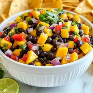 For a bright and tasty salsa, you need fresh, high-quality ingredients. Use: - 1 ripe mango, diced into small cubes - 1 red bell pepper, finely diced - 1 small red onion, finely chopped - 1 jalape&ntilde;o, seeded and minced - 1/4 cup fresh cilantro, roughly chopped - Juice of 2 limes, freshly squeezed These fresh ingredients bring color and flavor to your salsa. Canned and pantry items make this recipe quick and easy. You will need: - 1 can (15 oz) black beans, thoroughly rinsed and drained - 1 tablespoon extra virgin olive oil - Salt and freshly ground black pepper to taste Using canned beans saves time and adds protein to the dish. Want to take your salsa to the next level? Consider these options: - Add diced avocado for creaminess. - Mix in corn for sweetness and crunch. - Top with extra cilantro for a fresh look. These extras let you customize your salsa for your taste. {{ingredient_image_2}} Start by gathering all your ingredients. You will need: - 1 ripe mango, diced into small cubes - 1 can (15 oz) black beans, thoroughly rinsed and drained - 1 red bell pepper, finely diced - 1 small red onion, finely chopped - 1 jalape&ntilde;o, seeded and minced - 1/4 cup fresh cilantro, roughly chopped - Juice of 2 limes, freshly squeezed - 1 tablespoon extra virgin olive oil - Salt and freshly ground black pepper First, wash all your produce. Dice the mango into small cubes. Rinse the black beans under cold water. Cut the red bell pepper and onion into small pieces. Mince the jalape&ntilde;o, adjusting the amount for spice. Finally, chop the cilantro roughly. In a small bowl, squeeze the juice from the limes. Add the extra virgin olive oil. Season with a pinch of salt and a few cracks of black pepper. Whisk the mixture until it blends well. This dressing will add a bright flavor to your salsa. In a large mixing bowl, combine the diced mango, black beans, red bell pepper, red onion, and minced jalape&ntilde;o. Stir gently to mix the ingredients evenly. Next, fold in the chopped cilantro. Pour the lime dressing over the salsa mixture. Toss everything together with a spatula until well-coated. Taste your salsa. Adjust the seasoning with more salt or lime juice if needed. Let it rest for at least 15 minutes at room temperature. This time helps the flavors blend beautifully. Serve in a colorful bowl with crispy tortilla chips. Garnish with sprigs of cilantro for a nice touch. To pick a ripe mango, look for a few key signs. First, check the color; it should be golden-yellow or red, depending on the variety. Next, gently squeeze the mango. It should feel slightly soft but not mushy. A ripe mango also has a sweet smell near the stem. Choose one that feels heavy for its size. This means it has juicy flesh inside. If you find mangoes that are not ripe, you can leave them at room temperature for a few days. Jalape&ntilde;os can add a nice kick to your salsa. If you like it spicy, use a whole jalape&ntilde;o. For a milder flavor, use just half or even a quarter. Always remember to remove the seeds, as they hold most of the heat. If you want a different flavor, try a milder pepper, like a poblano or a sweet bell pepper. This way, you can control the heat level and please everyone&rsquo;s taste buds. You can boost the flavor of your salsa with extra ingredients. Try adding diced avocado for creaminess. Chopped tomatoes can add freshness. For crunch, include corn or cucumber. If you want more tang, a splash of vinegar or a pinch of sugar can help. Fresh herbs like mint or basil can also make your salsa unique. Experiment and find your favorite mix! Pro Tips Choose the Right Mango: Opt for a ripe mango that yields slightly to pressure for the best sweetness and flavor in your salsa. Customize the Spice Level: Adjust the amount of jalape&ntilde;o based on your tolerance for heat, or substitute with a milder pepper if preferred. Rest for Flavor: Allowing the salsa to sit for at least 15 minutes enhances the melding of flavors, making each bite more delicious. Storage Tips: Store any leftovers in an airtight container in the fridge for up to 2 days, but be aware that the texture may soften over time. {{image_4}} You can switch things up with tropical fruits. Try adding diced pineapple or fresh papaya. These fruits bring a sweet and tangy twist. If you want more variety, add avocado for creaminess. The smooth texture pairs well with the mango and beans. Black beans are great, but don&rsquo;t stop there! You can use kidney beans or chickpeas too. These options add different flavors and textures. Mixing in these legumes keeps the salsa exciting and unique. You can even try lentils for a fun twist. This salsa is already vegan and gluten-free, making it perfect for everyone. Just ensure your tortilla chips are gluten-free too. If you want to make it oil-free, skip the olive oil. The lime juice will still give it a bright flavor. Adjust based on your needs and enjoy! Store leftover mango black bean salsa in an airtight container. This keeps the salsa fresh. Place it in the fridge right after serving. It will last for about 3 to 5 days. Always use a clean spoon to scoop out what you need. This helps avoid germs. To keep your salsa fresh, use ripe ingredients. Choose firm mangoes and fresh herbs. If you have extra cilantro, store it in a glass of water in the fridge. Cover the glass with a plastic bag. This trick keeps it fresh longer. For other veggies, wrap them in a damp paper towel. Place them in a bag in the fridge. This keeps them crisp and full of flavor. You can freeze mango black bean salsa for later use. First, place it in a freezer-safe container. Leave some space for expansion. It will stay good for about 2 to 3 months. When ready to eat, thaw it in the fridge overnight. The texture may change a bit, but it still tastes great. Use frozen salsa in dishes like tacos or burritos for a quick meal. You can serve Mango Black Bean Salsa with tortilla chips for a crunchy snack. It also pairs well with grilled chicken or fish. Use it as a topping for tacos or burritos. This salsa adds a fresh taste to any meal. Try it on a bed of greens for a light salad. It's versatile and enhances many dishes. Mango Black Bean Salsa lasts about 3 to 5 days in the fridge. Store it in an airtight container to keep it fresh. The flavors will blend more over time, enhancing the taste. However, the mango may get mushy. For the best taste, eat it within a few days. Yes, you can make Mango Black Bean Salsa ahead of time. Prepare it a few hours or even a day in advance. This allows the flavors to meld nicely. Just remember to store it in the fridge. Stir it gently before serving to refresh the ingredients. Mango black bean salsa is simple and fun to make. We explored fresh and pantry ingredients, cooking steps, and tips for the best flavor. Don&rsquo;t forget the ideas for variations and storage! Enjoy your salsa with chips or tacos. You can also customize it to fit your taste. Making this salsa is easy and rewarding. Now, grab your ingredients and start mixing! You&rsquo;ll impress friends and family with this tasty dish.