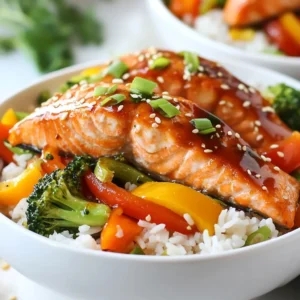 - 2 salmon fillets (approximately 6 oz each) - 1 cup jasmine rice - 1 cup mixed vegetables (suggested: bell peppers, broccoli, and carrots) - 1/4 cup soy sauce - 2 tablespoons honey - 1 tablespoon rice vinegar - 1 teaspoon minced fresh ginger - 1 teaspoon minced garlic - 1/2 teaspoon sesame oil - Salt and pepper to taste - 2 green onions, thinly sliced - Sesame seeds for garnish Gathering these ingredients is the first step to making your Teriyaki Salmon Rice Bowls. The salmon is the star here, rich in healthy fats and protein. Jasmine rice offers a light, fluffy base that pairs well with the teriyaki sauce. Adding mixed vegetables gives you color and crunch. For the teriyaki sauce, soy sauce brings that umami flavor. Honey adds sweetness, balancing the saltiness. Rice vinegar gives a tangy note, while ginger and garlic boost the taste. Finally, sesame oil adds a nutty aroma. Don't forget your seasonings! Salt and pepper enhance the flavors. The green onions and sesame seeds add a nice finish, making the dish pop. With these ingredients, you can create a meal that is both healthy and satisfying. {{ingredient_image_2}} - Start by rinsing 1 cup of jasmine rice under cold water. Keep rinsing until the water runs clear. This helps remove extra starch and makes the rice fluffy. - In a medium pot, boil 2 cups of water over high heat. When it boils, add the rinsed rice. - Lower the heat to a simmer and cover the pot. Let it cook for about 15 minutes until the water is absorbed. After cooking, let it sit for 5 minutes to steam. - In a small bowl, mix 1/4 cup of soy sauce, 2 tablespoons of honey, and 1 tablespoon of rice vinegar. - Add 1 teaspoon of minced ginger, 1 teaspoon of minced garlic, and 1/2 teaspoon of sesame oil to the bowl. - Whisk the mix until smooth and well combined. Set the teriyaki sauce aside for later. - Season both sides of 2 salmon fillets with salt and pepper. - Heat 1 tablespoon of olive oil in a skillet over medium heat. Once the oil shines, add the salmon skin-side down. - Cook the salmon for 4-5 minutes until the skin gets crispy. Flip the fillets and brush with teriyaki sauce. Cook for another 4-5 minutes until the salmon flakes easily. - After removing the salmon, add 1 cup of mixed vegetables to the same skillet. - Add a splash of water to help steam the veggies. Saut&eacute; for 3-4 minutes until they are tender but still crisp. Season with salt and pepper to taste. - Fluff the cooked jasmine rice with a fork. - Divide the rice into two bowls. Top each bowl with the saut&eacute;ed vegetables and teriyaki-glazed salmon. - Drizzle any extra teriyaki sauce over the salmon for more flavor. - Finish by adding sliced green onions on top of the bowls. - Sprinkle sesame seeds over everything for texture and crunch. To get the best salmon, you need to focus on cooking time and technique. Cook salmon fillets for about 4-5 minutes on each side. The skin should get crispy and the fish should be opaque. If you flip them gently, you will keep them whole. Choose fresh salmon fillets for the best flavor. Look for bright color and no fishy smell. Farm-raised or wild-caught both work well, but wild often tastes better. To avoid mushy rice, rinse jasmine rice under cold water until clear. This removes excess starch. Use 1 cup of rice with 2 cups of water. Bring the water to a boil, then reduce heat and cover the pot. Let it simmer for 15 minutes. After that, let it sit for 5 minutes with the lid on. Fluff the rice with a fork to keep it light and airy. Spices can add fun twists to your teriyaki sauce. Try adding a pinch of red pepper flakes for heat. You might also swap honey for maple syrup if you like. Fresh herbs like cilantro can brighten the dish, too. If you want a tangy kick, add a splash of lime juice. These small tweaks can make a big difference in flavor. Pro Tips Proper Rice Rinsing: Rinsing the jasmine rice until the water runs clear removes excess starch, which helps achieve a fluffy texture. Fish Freshness: Always choose fresh, high-quality salmon for the best flavor. Look for bright, moist fillets with no fishy smell. Adjust Sauce Sweetness: Feel free to adjust the amount of honey in the teriyaki sauce to suit your taste preferences. More honey will result in a sweeter sauce. Vegetable Variety: Customize your rice bowl by adding your favorite vegetables. Zucchini, snap peas, or mushrooms can also work beautifully! {{image_4}} You can switch salmon with chicken or tofu. For chicken, use boneless breasts or thighs. Cook them the same way as salmon. Sear the chicken in the skillet until it's golden. Then glaze it with the teriyaki sauce. For tofu, use firm or extra-firm. Press it to remove water, then cut it into cubes. Saut&eacute; it in the skillet until golden and crispy. Brush the teriyaki sauce on the tofu to add flavor. Feel free to change up the veggies. You can use seasonal options like zucchini, snap peas, or asparagus. These add color and nutrients. Spice it up with some chili flakes or a dash of sesame oil. You can also mix in sauces like hoisin or sriracha for extra flavor. Just saut&eacute; the veggies until they are tender but still crisp. Try different types of rice for your bowl. Brown rice adds a nutty taste and is healthier. Quinoa is another great option for protein. You can also serve the bowl with a side of edamame or seaweed salad. These sides enhance the meal and provide a balanced plate. Enjoy experimenting with different textures and flavors! To keep your teriyaki salmon rice bowls fresh, use airtight containers. Glass or plastic containers work well. Make sure to cool the food before sealing it. Store any leftovers in the fridge. They will last for about 2 to 3 days. For the best flavor, reheat the salmon and rice gently. Use a microwave or a skillet. If using a microwave, cover the bowl to prevent drying. Heat in short bursts, checking often. For the skillet, add a drop of water to keep moisture. Reheat the rice separately to avoid overcooking the salmon. Yes, you can freeze teriyaki salmon! Wrap the salmon tightly in foil or plastic wrap. Place it in a freezer-safe bag. This way, it can last up to 3 months. To thaw, move it to the fridge overnight. Reheat gently after thawing to keep the salmon juicy. To check if salmon is cooked, look for a few signs. The flesh should change from a bright red to a pale pink. Use a fork to see if it flakes easily. If it does, it&rsquo;s ready! You can also check the internal temperature. It should reach 145&deg;F (63&deg;C). If you&rsquo;re unsure, it&rsquo;s better to cook it a little longer than to undercook it. Yes, you can make teriyaki sauce in advance. Store it in an airtight container in the fridge. It stays fresh for about a week. This way, you can save time on busy nights. Just give it a good stir before using it again. You can also freeze the sauce for longer storage. Just thaw it in the fridge overnight when you&rsquo;re ready to use it. You can serve many delicious sides with your teriyaki salmon rice bowls. Here are some great options: - Steamed broccoli - Saut&eacute;ed spinach - Cucumber salad - Miso soup - Edamame These sides add flavor and nutrition to your meal. This recipe can be made gluten-free. Use gluten-free soy sauce instead of regular soy sauce. Many brands offer gluten-free options that taste great. Always check the labels to make sure. With this swap, you can enjoy a tasty meal that suits your diet. Yes, you can use brown rice instead of jasmine rice. However, cooking times will change. Brown rice takes longer to cook, about 40-45 minutes. Use 2.5 cups of water for every cup of brown rice. Remember to adjust the cooking time to ensure it&rsquo;s tender and fluffy. This blog post covered how to make tasty Teriyaki Salmon Rice Bowls. You learned about the main ingredients, from salmon fillets to fresh veggies and teriyaki sauce. I shared step-by-step instructions for cooking everything to perfection. Remember to try different proteins or veggies for fun twists. Store leftovers properly to enjoy your meal later. With these tips, cooking these bowls will be easy and delicious. Enjoy your tasty creation!