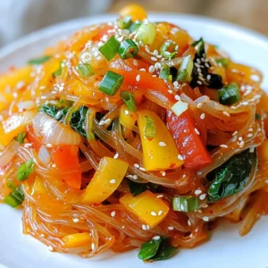 - 8 oz (225 g) sweet potato glass noodles - 2 tablespoons sesame oil - 1 medium onion, thinly sliced - 1 medium carrot, julienned - 1 bell pepper (red or yellow), sliced into thin strips - 2 cups fresh spinach leaves - 3 green onions, finely chopped - 3 cloves garlic, minced - 2 tablespoons gochujang (Korean red chili paste) - 1 tablespoon soy sauce - 1 tablespoon sugar (or honey for a natural sweetness) - 1 tablespoon sesame seeds, toasted - Salt and pepper to taste If you can&rsquo;t find sweet potato glass noodles, you can use regular rice noodles. For sesame oil, olive oil works too, though it changes the flavor slightly. You can switch the bell pepper for zucchini or broccoli if you prefer. If you want to avoid gochujang, try Sriracha for some heat. For a sweetener, maple syrup can replace sugar or honey. Sweet potato glass noodles are lower in calories and carbs than regular noodles. They also provide fiber and some vitamins. Spinach is full of iron and helps with energy. Bell peppers add vitamin C, which boosts your immune system. Sesame oil has healthy fats that support heart health. Garlic is known for its health benefits, including boosting your immune system. These ingredients not only taste great together but also pack a nutritious punch. {{ingredient_image_2}} To start, soak the sweet potato glass noodles in warm water for about 30 minutes. This step softens the noodles and makes them perfect for our dish. After soaking, drain the noodles and set them aside. They will be ready to mix with the veggies soon. Heat 2 tablespoons of sesame oil in a large skillet or wok over medium heat. Once it's hot, add the thinly sliced onion and julienned carrot. Saut&eacute; them for 2-3 minutes. You want them to soften and smell great. Next, add the sliced bell pepper, fresh spinach, and minced garlic. Stir-fry everything together for 3-4 minutes. The spinach should wilt, and the bell peppers should become tender. This creates a colorful and tasty mix. In a small bowl, mix 2 tablespoons of gochujang, 1 tablespoon of soy sauce, 1 tablespoon of sugar, and 1 tablespoon of toasted sesame seeds. This will be your spicy sauce. If you like it spicier, add more gochujang. Now, add the soaked sweet potato glass noodles to the skillet with the saut&eacute;ed veggies. Drizzle the spicy sauce over everything and toss to coat. Cook for an extra 2-3 minutes until everything is warm and mixed together well. Stir in the chopped green onions and season with salt and pepper. Serve the noodles hot, and feel free to add more sesame seeds on top for a nice crunch. You can change the heat in this dish easily. Start with 2 tablespoons of gochujang. If you want more heat, add more gochujang. Mix in small amounts and taste as you go. This way, you get the spice just right for you. For a milder dish, reduce the gochujang or swap it for a mild chili paste. You can even try adding a touch of honey to balance the spice. Soaking the sweet potato glass noodles is key. Soak them in warm water for about 30 minutes. This softens them perfectly. Drain them well before adding to the wok. When stir-frying, don&rsquo;t overcrowd the pan. This helps the noodles cook evenly. Toss everything gently to avoid breaking the noodles. Make sure to coat them well with the sauce for the best flavor. For a beautiful presentation, serve the noodles in a large bowl. Top with extra green onions and toasted sesame seeds. You can also add some fresh cilantro for color. Slices of fresh chili add a nice touch. For a fun twist, serve with lime wedges on the side. The lime adds a zesty kick when squeezed over the dish. Enjoy your colorful, spicy glass noodles! Pro Tips Soak Noodles Correctly: Ensure the sweet potato glass noodles are soaked in warm water for the recommended time to achieve the perfect texture. Over-soaking can lead to a mushy consistency. Adjust the Heat: Feel free to modify the amount of gochujang based on your heat preference. Start with less if you're unsure, and add more to taste as you mix. Colorful Garnishes: Enhance the visual appeal and flavor by adding fresh herbs or sliced chilies as a garnish. They not only look great but also add an aromatic freshness. Leftover Storage: If you have leftovers, store them in an airtight container in the fridge. Reheat gently in a pan over low heat to prevent the noodles from becoming too sticky. {{image_4}} You can easily make this dish vegetarian or vegan. Simply skip any meat and focus on the veggies. The sweet potato glass noodles are already vegan. Use more fresh vegetables like mushrooms or zucchini to add depth. You can also add tofu for protein. Tofu absorbs flavors well, making it a great addition. If you want to add protein, chicken is a great choice. Cut it into small pieces and cook it before the veggies. Cook it until it's no longer pink. For a vegan option, use firm tofu. Press it to remove extra water, then cut it into cubes. Saut&eacute; the tofu until golden, then mix it with the veggies and noodles. If you need a gluten-free option, use tamari instead of regular soy sauce. Tamari has a similar flavor but is safe for those avoiding gluten. You can also try coconut aminos, which offer a sweeter taste. Both options work well in this recipe, keeping it tasty and safe for those with gluten sensitivities. To keep your Korean spicy glass noodles fresh, place them in an airtight container. Make sure the noodles cool down to room temperature first. Store the container in the fridge. They will stay good for about 3-4 days. If you want to keep them longer, consider freezing them. When you&rsquo;re ready to enjoy leftovers, you can reheat them easily. Use a pan over medium heat. Add a splash of water or a bit of sesame oil to help loosen the noodles. Stir gently for about 5-7 minutes until they're hot. You can also use the microwave. Heat in short bursts, stirring between each, until warmed through. If you want to freeze your spicy glass noodles, portion them into freezer bags. Remove as much air as possible before sealing. They can last up to 2 months in the freezer. To thaw, move them to the fridge overnight. Reheat as mentioned above for best results. Enjoy your delicious meal whenever you want! Korean glass noodles are made from sweet potato starch. This gives them a unique chewy texture. They are also gluten-free. You can find these noodles in many Asian markets. They soak up flavors well, making them perfect for stir-fry dishes. To make glass noodles softer, soak them in warm water. Let them sit for about 30 minutes. This softens them perfectly for cooking. Drain the noodles before using them in your dish. This step is key to achieving the right texture. Yes, you can use different vegetables in this recipe. Feel free to mix and match based on your taste. Broccoli, zucchini, or snap peas work well too. Just remember to cut them into thin strips for even cooking. Enjoy personalizing your dish! This blog post covered key ingredients for a great dish and their health benefits. You learned step-by-step instructions to create perfect sweet potato glass noodles. We discussed tips to adjust flavors and cooking methods for the best results. Also, we explored variations, including vegan options and protein add-ins. Finally, we shared storage tips to keep your leftovers fresh. Overall, you now have all the tools to create, enjoy, and customize this dish!