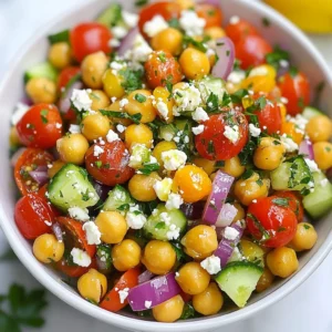 To make a delicious Mediterranean Chickpea Salad, you need fresh and simple ingredients. Here’s what you’ll need: - Canned Chickpeas - Fresh Vegetables: - 1 cup cherry tomatoes, halved - 1/2 cucumber, diced into small cubes - 1/4 red onion, finely chopped - 1/2 bell pepper, diced - Kalamata Olives: - 1/4 cup, pitted and sliced - Feta Cheese: - 1/4 cup, crumbled (or use vegan cheese) - Fresh Herbs: - 1/4 cup fresh parsley, coarsely chopped - Seasonings: - 3 tablespoons high-quality olive oil - 1 tablespoon freshly squeezed lemon juice - 1 teaspoon dried oregano - Salt and freshly cracked black pepper to taste Each ingredient plays a role in creating bright flavors. The chickpeas provide protein and texture. The vegetables add crunch and color. The olives and feta give a salty kick. Fresh herbs bring brightness, while the dressing ties it all together. This mix creates a salad that is not just tasty but also vibrant and healthy. {{ingredient_image_2}} Start with one can of chickpeas. Rinse them well under cold water. This removes any salty brine. Then, drain them in a colander. Make sure they are dry. This helps the salad stay fresh. Next, take your fresh veggies. Cut one cup of cherry tomatoes in half. Dice half a cucumber into small cubes. Finely chop a quarter of a red onion. Then, dice half a bell pepper. You can choose red or yellow. In a small bowl, mix three tablespoons of olive oil. Add one tablespoon of lemon juice. Then, sprinkle in one teaspoon of dried oregano. Finish with a pinch of salt and black pepper. Whisk this mixture until it is smooth and well-blended. In a large mixing bowl, add the chickpeas, cherry tomatoes, cucumber, red onion, bell pepper, and Kalamata olives. This makes the base of your salad colorful and tasty. If you like, sprinkle in a quarter cup of crumbled feta cheese. Add a quarter cup of chopped parsley for freshness. This step brings in more flavor and a beautiful look. Now, take your prepared dressing. Drizzle it over the salad mixture. Using a large fork or salad tongs, gently toss everything together. Make sure every piece is coated in the dressing. This step helps mix all the flavors. Let the salad rest for at least 10 minutes. This allows the ingredients to marinate. The flavors will blend and taste even better! Adjusting Seasonings To make your salad shine, taste is key. Start with the basic salt and pepper. After mixing, you can add more if needed. You may want to add a bit more lemon juice for brightness. Each bite should be full of flavor but not too salty. If you like a kick, try a pinch of red pepper flakes. Adjust the seasonings until it feels just right for you. Marinating Time Letting the salad rest is very important. After mixing everything, let it sit for at least 10 minutes. This time helps the flavors mix well. If you have more time, you can let it sit longer. The longer it rests, the more flavor it gains. Just cover it and keep it in the fridge. Serving Suggestions How you serve the salad matters. A large, shallow bowl shows off the colors well. You can also use individual plates for a nice touch. This makes each serving feel special. Pair your salad with crusty bread or pita chips for a full meal. Garnishing Techniques Garnish can make your dish pop. Use fresh parsley on top for color. You can also add a lemon wedge on the side. This not only adds beauty but also lets guests add a bit more lemon if they want. A sprinkle of feta on top can also enhance the look. Each of these small touches makes your Mediterranean Chickpea Salad even more inviting. Pro Tips Fresh Ingredients: Always opt for the freshest vegetables you can find; they enhance the flavor and nutritional value of the salad. Chill Before Serving: Refrigerate the salad for about 30 minutes before serving to allow the flavors to meld and the salad to be refreshing. Customize Your Dressing: Feel free to experiment with different herbs or vinegars in the dressing to suit your taste preferences. Meal Prep Friendly: This salad can last in the fridge for a couple of days, making it a perfect option for meal prepping for the week. {{image_4}} When making Mediterranean Chickpea Salad, you can easily swap some ingredients. Here are a few ideas: - Vegan Alternatives If you want a vegan salad, use vegan cheese instead of feta. It keeps the creamy texture. You can also skip cheese altogether if you prefer. - Seasonal Vegetables Use what is fresh and in season. Try adding diced zucchini in summer or roasted butternut squash in fall. You can also use different colored bell peppers for a fun twist. Changing the dressing can give your salad a whole new taste. Here are some options: - Different Dressings to Try You can mix things up with a balsamic vinaigrette or a tahini dressing. Both add unique flavors that work well with chickpeas. - Adjusting Flavor Profiles If you like it spicy, add a pinch of red pepper flakes to the dressing. For a garlic punch, mix in minced garlic. This way, you can create a salad that suits your taste. Store your Mediterranean Chickpea Salad in a sealed container. Refrigerate it right away. This keeps the salad fresh and safe. Use a glass or plastic container with a lid. You can keep the salad in the fridge for up to three days. After that, the ingredients may lose their crunch. If you notice any changes in smell or color, it is best to discard it. You can freeze the salad, but some ingredients may change texture. It’s best to freeze only the chickpeas and veggies. Avoid freezing feta cheese and fresh herbs. To freeze, place the salad in a freezer-safe bag. Remove as much air as possible. Label the bag with the date. Use it within three months for best taste. Thaw the salad in the fridge overnight. This keeps it fresh. Once thawed, toss it gently. Add fresh herbs or feta cheese for extra flavor. Enjoy your salad again! Yes, you can make this salad ahead of time. Prepare the salad and store it in the fridge. The flavors blend well and taste great the next day. Just add the dressing before serving for a fresh taste. This salad pairs well with many dishes. Try serving it with grilled chicken, fish, or pita bread. You can also enjoy it with hummus, tzatziki, or a warm flatbread. Each option adds a nice touch to your meal. You can easily tweak this salad for different diets. Use vegan cheese instead of feta for a plant-based option. If you are gluten-free, ensure the dressing has no gluten-based ingredients. Always check labels to avoid allergens. Absolutely! You can swap chickpeas for other beans. Black beans, kidney beans, or white beans work well. Each type adds a unique flavor and texture to your salad. Experiment to find your favorite combination. This blog post detailed how to create a tasty Mediterranean chickpea salad. You learned about the fresh ingredients, step-by-step preparation, and tips for great flavor. We also explored fun variations and storage methods. Remember, making this salad is simple and flexible. You can adjust ingredients to suit your taste or diet. Enjoy crafting your own version, and share it with others. This salad is sure to impress!