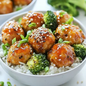 - 1 lb (450g) ground chicken - 1/4 cup (30g) breadcrumbs - 1/4 cup (25g) green onions, finely chopped - 1 tablespoon fresh ginger, grated - 2 cloves garlic, minced - 1 large egg - 1/4 cup (60ml) soy sauce - 2 tablespoons (30ml) honey or maple syrup - 1 tablespoon (15ml) sesame oil - 1 teaspoon (5ml) rice vinegar - 1 cup (200g) jasmine rice - 2 cups (about 150g) broccoli florets - Sesame seeds for garnish - Additional chopped green onions for garnish (optional) You can swap ground chicken for turkey. This keeps the dish lean. If you want a vegetarian option, use plant-based ground meat. Instead of breadcrumbs, you can use crushed rice cakes or oats for a gluten-free option. For a soy-free version, use coconut aminos instead of soy sauce. Honey can be replaced with agave syrup or a sugar substitute if you need it vegan. Each serving of this dish contains: - Calories: 400 - Protein: 30g - Carbohydrates: 50g - Fat: 10g - Fiber: 3g - Sugar: 5g These values may vary based on specific ingredients used. This meal offers a good balance of protein, carbs, and healthy fats, making it a great option for family meals. {{ingredient_image_2}} Start by gathering your ingredients. You need ground chicken, breadcrumbs, green onions, ginger, garlic, egg, soy sauce, honey, sesame oil, and rice vinegar. In a large bowl, mix the ground chicken and breadcrumbs. Then, add chopped green onions, grated ginger, minced garlic, and the egg. Use your hands or a spatula to mix until everything is well combined. Next, shape the mixture into meatballs. Make them about 1 inch in diameter. This size ensures they cook evenly. Place the meatballs on a lined baking sheet, leaving space between each one. Preheat your oven to 400&deg;F (200&deg;C). This step is important for crispy meatballs. Once the oven is hot, bake the meatballs for 15 to 20 minutes. Look for a golden brown color. To check if they are done, use a meat thermometer. The inside should reach 165&deg;F (75&deg;C). While the meatballs bake, cook the jasmine rice. Follow the package instructions. The rice should be fluffy and warm when ready. Set it aside while you steam the broccoli. For the broccoli, bring water to a boil in a pot. Add the broccoli florets and steam for 4 to 5 minutes. You want them to be bright green and tender. Drain the broccoli when done. Once the meatballs are cooked, take them out of the oven. Toss the meatballs in the warmed teriyaki sauce. Make sure they are well coated. Now, it&rsquo;s time to assemble your bowls. Start with a generous scoop of jasmine rice in each bowl. Add the teriyaki-coated meatballs on top. Place the steamed broccoli beside the meatballs. For extra flavor, drizzle any remaining teriyaki sauce over everything. Finish by garnishing with sesame seeds and more chopped green onions if you like. This adds color and crunch to your dish! Enjoy your meal. To make great meatballs, you need the right mix. The ground chicken should be moist but not too wet. Use breadcrumbs to help bind the meat. When you mix the ingredients, don't overwork them. This helps keep the meatballs tender. Shape them into small balls, about one inch in size. This size cooks evenly. You can boost flavor easily. Add more green onions or some red pepper flakes for heat. A splash of lime juice can add a nice zest. Consider using chopped cilantro for a fresh taste. If you want a bolder flavor, try adding a dash of garlic powder or onion powder. Serving is just as important as cooking. Use bright bowls to make the dish pop. Layer the rice, meatballs, and broccoli neatly. Drizzle extra teriyaki sauce on top for flair. Finish with a sprinkle of sesame seeds and more green onions. You can also add a lime wedge on the side for a fresh touch. This makes the meal look fun and inviting! Pro Tips Use Fresh Ingredients: Fresh ginger and garlic can significantly enhance the flavor of your meatballs. Always opt for fresh over powdered or jarred versions for the best taste. Mix with Care: When combining the meatball ingredients, avoid overmixing as this can lead to dense meatballs. Just mix until everything is combined. Customize Your Sauce: Feel free to adjust the sweetness or saltiness of the teriyaki sauce by adding more honey or soy sauce according to your preference. Perfectly Cooked Broccoli: To ensure your broccoli retains its bright green color and crisp texture, do not oversteam. Aim for 4 to 5 minutes of steaming, then immediately cool in ice water. {{image_4}} You can switch up the sauce for a unique taste. Try using teriyaki sauce with a twist. Mix in some sriracha for heat, or add pineapple juice for sweetness. If you like a tangy flavor, a mix of barbecue sauce and soy sauce works great too. For a fresh take, consider using a miso glaze or a honey-soy sauce blend. Each option brings a new flavor profile to your meatball bowls. Feel free to add your favorite vegetables to the bowls. Snap peas, bell peppers, or carrots all work nicely. You can also try bok choy or zucchini for a different crunch. If you want more greens, spinach or kale is a healthy choice. Don&rsquo;t be afraid to mix and match! Just steam or saut&eacute; them, and they will add color and nutrition to your meal. Switching to noodles is a fun way to change the dish. You can use soba, udon, or rice noodles for a different base. Simply cook the noodles according to the package instructions. Then, place the teriyaki meatballs and veggies on top. Drizzle with sauce, and you have a new meal! This variation still keeps the dish healthy and satisfying. Store any leftover teriyaki chicken meatballs in an airtight container. Keep them in the fridge for up to three days. Make sure they cool before sealing the container. This helps keep them fresh and tasty. To reheat, you can use a microwave or an oven. If using a microwave, place the meatballs on a plate. Heat them for 1-2 minutes or until hot. For the oven, preheat it to 350&deg;F (175&deg;C). Place meatballs on a baking sheet and warm for about 10 minutes. Add a bit of teriyaki sauce to keep them moist. You can freeze the meatballs for easy meals later. Store them in a freezer-safe bag or container. They can last up to three months in the freezer. To thaw, move them to the fridge overnight. Reheat as mentioned above when ready to eat. This makes meal prep a breeze! Yes, you can use ground turkey instead of chicken. Turkey works well as a lean option. It has a mild flavor, much like chicken. Just follow the same steps in the recipe. The meatballs will still taste great! You can use tamari as a gluten-free option. Tamari has a similar taste to soy sauce. It gives your teriyaki sauce the same rich flavor. Coconut aminos is another great choice. It is slightly sweeter but works well in this recipe. To check if the meatballs are done, use a meat thermometer. They should reach an internal temperature of 165&deg;F (75&deg;C). You can also cut one open. The inside should be no longer pink, and the juices should run clear. Yes, you can prepare the meatballs ahead. Make them and store them in the fridge for up to a day. You can also freeze them for longer storage. Just bake them when you are ready to eat. Cook the rice and broccoli fresh for the best taste. This blog post covered how to make delicious meatball bowls. We discussed the key ingredients, step-by-step cooking instructions, and tips for great flavor and texture. We explored variations, like swapping rice for noodles or trying different sauces. You also learned about storing leftovers and reheating options. Remember, cooking is about trying new things. Use this guide to make your own tasty meals. Enjoy your cooking journey!