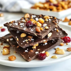 - 12 ounces of high-quality dark chocolate (70% cocoa or higher) - 1 cup of mixed nuts (such as almonds, walnuts, and pecans) - 1/2 cup of dried fruit (choose from cranberries, cherries, or apricots) - 1 teaspoon of pure vanilla extract - Flaky sea salt for finishing touches Using high-quality chocolate is very important. Dark chocolate with 70% cocoa or more gives rich taste. It melts well and holds its shape. When picking nuts, choose a mix you love. Almonds, walnuts, and pecans add crunch and flavor. For dried fruits, cranberries, cherries, and apricots can bring sweetness. Fresh, good quality ingredients make the bark taste amazing. Always look for nuts without added salt or sugar. This keeps the flavors balanced and pure. {{ingredient_image_2}} Start by lining a baking sheet with parchment paper. This is key to your success. The parchment stops the chocolate from sticking. It also makes cleaning easy after you finish. You want to focus on the fun part&mdash;eating! You can melt chocolate in two ways: the microwave or a double boiler. If you use the microwave, cut the chocolate into small pieces. Place it in a safe bowl. Heat it for 30 seconds at a time. After each round, stir it well. This keeps the chocolate from burning. If you choose a double boiler, use low heat and stir gently. The steam will melt the chocolate slowly. This method gives you a nice, smooth finish. Once your chocolate is melted, it&rsquo;s time to mix in some flavor! Add one teaspoon of pure vanilla extract. Stir it in well to spread the flavor evenly. Next, fold in your mixed nuts and dried fruit. Use a spatula to make sure every piece gets coated in chocolate. It should all look rich and delicious! Carefully pour your chocolate mix onto the lined baking sheet. Use a spatula to spread it out evenly. Aim for about a quarter inch thick. While it's still warm, sprinkle flaky sea salt on top. This adds a nice touch! You can adjust the salt to your taste. Then, place the sheet in the fridge. Let it chill for 1 to 2 hours until it&rsquo;s firm. Once set, break it into pieces. You can use your hands or a knife. The bark should look great with all the nuts and fruit visible! To melt chocolate well, I suggest using the microwave. Cut your dark chocolate into small pieces. Place them in a bowl. Heat for 30 seconds, then stir. Repeat until smooth. This keeps it glossy. If you prefer, use a double boiler. It gently melts the chocolate without burning. For salt levels, taste is key! Start with a light sprinkle of flaky sea salt. You can always add more later. Balance the sweet and salty for the best flavor. Adjust it based on your preference. Some like it salty, while others prefer less. When serving, arrange the bark pieces on a pretty plate. This makes it look festive. You can also stack them for height. For gifts, wrap each piece in cellophane. Tie with a colorful ribbon for extra charm. This makes it a perfect treat for friends or family. Dark chocolate has many benefits. It is rich in antioxidants. These help fight free radicals in the body. Chocolate with 70% cocoa or higher offers more health perks. It can improve heart health and boost mood. Nuts add healthy fats and protein. They provide crunch and flavor to your bark. Almonds, walnuts, and pecans are great choices. Dried fruits like cranberries and cherries add sweetness. They also bring vitamins and minerals. Together, these ingredients create a tasty and nutritious treat. Pro Tips Choose Quality Chocolate: Selecting high-quality dark chocolate will significantly enhance the flavor of your bark. Look for chocolate with a cocoa content of 70% or higher for a rich, intense taste. Mix and Match Ingredients: Feel free to customize your bark by using different nuts and dried fruits! Try macadamia nuts with mango or cashews with goji berries for unique flavor combinations. Perfecting the Salt Sprinkle: When sprinkling the sea salt, do it while the chocolate is still warm. This ensures the salt sticks well and enhances the chocolate's flavor. Store for Freshness: For optimal freshness, store your bark in an airtight container. This will help maintain its texture and prevent it from absorbing moisture. {{image_4}} You can change the nuts in your bark for a new taste. Try using cashews, hazelnuts, or even sunflower seeds. Each nut adds its own unique crunch and flavor. You can also mix in spices like cinnamon or chili powder. A drop of almond extract can give it a delightful twist too. These small changes can make your bark truly special. If you want a vegan bark, use dairy-free dark chocolate. Many brands offer great options that taste just as good. For gluten-free needs, this recipe works perfectly. Just ensure the nuts and any dried fruit you choose are also gluten-free. This way, everyone can enjoy a sweet bite without worries. For the holidays, think about adding festive toppings. Try crushed peppermint or a sprinkle of festive sprinkles. You can also use seasonal fruits like dried figs or apricots for a fresh touch. They add color and flavor, making your bark stand out on any dessert table. Store your dark chocolate sea salt bark in an airtight container. This keeps the bark fresh and tasty. You can keep it at room temperature for easy snacking. If you like a firmer texture, put it in the fridge. Just be aware that cold storage may make it a bit harder to break into pieces. For the best taste, enjoy your bark within two weeks. You may notice it stays fresh for a bit longer, but it&rsquo;s best to eat it sooner. Signs of spoilage include a change in color or texture. If it looks dull or feels sticky, it&rsquo;s time to toss it. If you have leftover bark, get creative! You can chop it up and mix it into ice cream. It also works well as a topping on yogurt or oatmeal. You can even sprinkle it over brownies for an extra special treat. The options are endless! To make dark chocolate sea salt bark, start by lining a baking sheet with parchment paper. Melt high-quality dark chocolate in a microwave or double boiler. Stir in vanilla extract and mix in nuts and dried fruit. Spread this mixture on the lined sheet and sprinkle with flaky sea salt. Chill in the fridge for 1 to 2 hours until set, then break into pieces. For bark, choose dark chocolate with 70% cocoa or higher. Higher cocoa percentages provide rich flavor and health benefits. Quality matters; look for brands that use high-grade cocoa beans. This choice enhances taste and texture, making your bark special. Yes, you can use milk chocolate. However, it has a sweeter taste and less depth than dark chocolate. Milk chocolate may not provide the same contrast with sea salt. If you love sweetness, it can be a great choice. Just note that the flavors will differ. The bark takes about 1 to 2 hours to set in the fridge. If you want it to firm up quickly, keep it in the cold. Make sure it's completely firm before breaking it into pieces. This ensures a clean break and nice texture. Absolutely! You can add various toppings to your bark. Try coconut flakes, seeds, or even crushed candy. Other dried fruits or spices can also work well. Get creative and make it your own! Just ensure that the toppings are evenly distributed for the best flavor. You learned how to make dark chocolate sea salt bark using quality ingredients. We discussed the main components, flavor enhancers, and important steps for successful results. I shared tips for perfect texture and health benefits, plus fun variations to try. Remember, the quality of your chocolate and mix-ins matter most. With the right care, your bark can shine as a tasty treat or a fun gift. Enjoy making your own delicious creations!