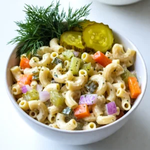 - 8 oz elbow macaroni or rotini pasta - 1 cup diced dill pickles - &frac12; cup finely diced red onion - &frac12; cup diced bell pepper The stars of this salad are the pasta and pickles. You can use either elbow macaroni or rotini pasta. Both work well with the creamy dressing. The diced dill pickles add a tangy crunch that makes this dish special. You should also add finely diced red onion and bell pepper for a nice flavor contrast. The red onion gives a bit of sharpness, while the bell pepper adds sweetness. - &frac14; cup mayonnaise or Greek yogurt - 2 tablespoons dill pickle juice - 1 teaspoon Dijon mustard - 1 teaspoon dried dill For the dressing, you can choose between mayonnaise or Greek yogurt. Greek yogurt gives a lighter feel, while mayonnaise adds creaminess. Then, add dill pickle juice for extra tang. Dijon mustard adds a touch of spice, and dried dill enhances the pickle flavor. Mix these together for a creamy dressing that coats the pasta well. - Salt and black pepper to taste - Fresh dill sprigs for garnish Don&rsquo;t forget to season your dish! Add salt and black pepper to taste. This step is key to bringing out all the flavors. Finally, use fresh dill sprigs as a garnish. They not only look great but also add a fresh aroma that makes the salad even better. {{ingredient_image_2}} First, bring a large pot of salted water to a boil. Add 8 oz of elbow macaroni or rotini. Cook until the pasta is al dente, or firm to the bite. This usually takes about 8-10 minutes. Once done, drain the pasta in a colander. Rinse it under cold water. This helps stop the cooking and cools the pasta quickly. While your pasta cooks, chop the veggies. Take 1 cup of dill pickles, &frac12; cup of finely diced red onion, and &frac12; cup of diced bell pepper. You can use green or yellow bell pepper for a sweet touch. Make sure all pieces are small and even. This helps the flavors mix well. In a medium bowl, mix the dressing. Combine &frac14; cup of mayonnaise or Greek yogurt, 2 tablespoons of dill pickle juice, and 1 teaspoon of Dijon mustard. Add 1 teaspoon of dried dill. Season with salt and black pepper to taste. Stir until creamy and well mixed. In a large bowl, add the cooled pasta. Then, add the diced dill pickles, red onion, and bell pepper. Pour the dressing over the pasta and veggies. This is where the magic happens! Use a spatula or large spoon to gently toss everything together. Make sure every piece is coated in dressing. Cover the bowl with plastic wrap or a lid. Refrigerate for at least 30 minutes to let the flavors meld. Before serving, stir the salad well. Taste it to see if you need more salt, pepper, or pickle juice. For a lovely touch, garnish with fresh dill sprigs and some reserved pickle slices. Enjoy this bright and tangy pasta salad! Adjust the seasoning and dressing to your taste. Start with the basics. Add salt and pepper as you mix. If you want more zing, add more dill pickle juice. You can also tweak the dressing by adding a bit more mustard or dill. This helps to bring out all the flavors. Taste as you go to find your perfect mix. This pasta salad is best served chilled. It tastes great on a hot day. Use colorful dishes to make it pop. A bright bowl can make your meal more fun. You can serve it as a side dish or the main course. Either way, it&rsquo;s sure to please. Make your salad look extra special. Use fresh garnishes like dill sprigs. Place them on top just before serving. You can also add a few pickle slices for a nice touch. This adds color and makes it look inviting. A well-presented dish makes the meal even better! Pro Tips Perfect Pasta Texture: Make sure to cook the pasta just until al dente. This will ensure that the pasta retains a slight bite and doesn't become mushy when mixed with the dressing and vegetables. Customize Your Veggies: Feel free to mix in other vegetables like cucumbers or cherry tomatoes for added color and texture. Just make sure they are finely chopped to match the size of the pasta. Flavor Boost: For an extra kick, consider adding a pinch of cayenne pepper or a splash of hot sauce to the dressing. This will add a subtle heat that complements the tanginess of the pickles. Make-Ahead Magic: This pasta salad is perfect for meal prep! You can make it a day in advance, and the flavors will only get better as it sits in the fridge. {{image_4}} You can make this salad lighter. Substitute Greek yogurt for mayonnaise. Greek yogurt still adds creaminess. It also boosts protein and cuts fat. This swap keeps the same great taste. You get a fresher feel with every bite. Want to make it heartier? Consider adding cooked chicken or chickpeas. Cooked chicken gives a nice protein boost. Chickpeas add a plant-based option. Both options mix well with the pasta. They make the salad fill you up more. Feel free to experiment with different veggies. Try adding crunchy celery or sweet carrots. Both add texture and flavor. You can even toss in peas or corn. Each veggie brings its own unique taste. This keeps the salad fun and fresh. Store leftover Dill Pickle Pasta Salad in an airtight container. This keeps it fresh and tasty. Make sure to cool the salad to room temperature before sealing. It will last well in the fridge for about 3 to 5 days. If you notice any changes in color or smell, it&rsquo;s best to throw it away. For the best taste, enjoy your pasta salad within 3 days. After that, it may lose its crunch and flavor. The pickles can get too soft, and the dressing may separate. If you plan to keep it longer, consider other storage options. You can freeze pasta salad, but I don't recommend it. Freezing can change the texture of the pasta and veggies. If you want to try, place the salad in a freezer-safe container. Leave some room for expansion. To thaw, move it to the fridge overnight before serving. Enjoy it fresh for the best flavor! To make this salad vegetarian, you don't need to change much. The main ingredients are already plant-based. Just ensure any mayo you use is vegetarian-friendly. You can swap regular mayo for vegan mayo if you want. If you want more crunch, add chopped celery or shredded carrots. Both add great flavor and texture. Yes, you can use other pasta types. Penne or fusilli works well too. Just remember to cook your pasta until it is al dente. For elbow macaroni or rotini, usually, it takes about 7-10 minutes. Check the package for exact cooking times. You can make this pasta salad gluten-free. Choose gluten-free pasta made from rice or corn. Most grocery stores have good options. Just follow the cooking times on the package, as they can vary a bit from regular pasta. You can store this salad in the fridge for up to 3 days. Just keep it in an airtight container. If you notice any changes in smell or color, it&rsquo;s best to throw it away. Always check for freshness before eating leftovers. Yes, this salad is great to make ahead. I recommend making it a day before you plan to serve it. This allows the flavors to mix well. Just remember to cover it tightly and store it in the fridge. Before serving, give it a good stir to refresh the flavors. In this blog post, we gathered everything you need for a delicious Dill Pickle Pasta Salad. You learned about the key ingredients, from pasta and veggies to the creamy dressing. We also shared step-by-step instructions to make it easy. Lastly, we covered storage tips and variations to suit your taste. Enjoy this refreshing dish for any occasion. Experiment with flavors and make it your own. Happy cooking!